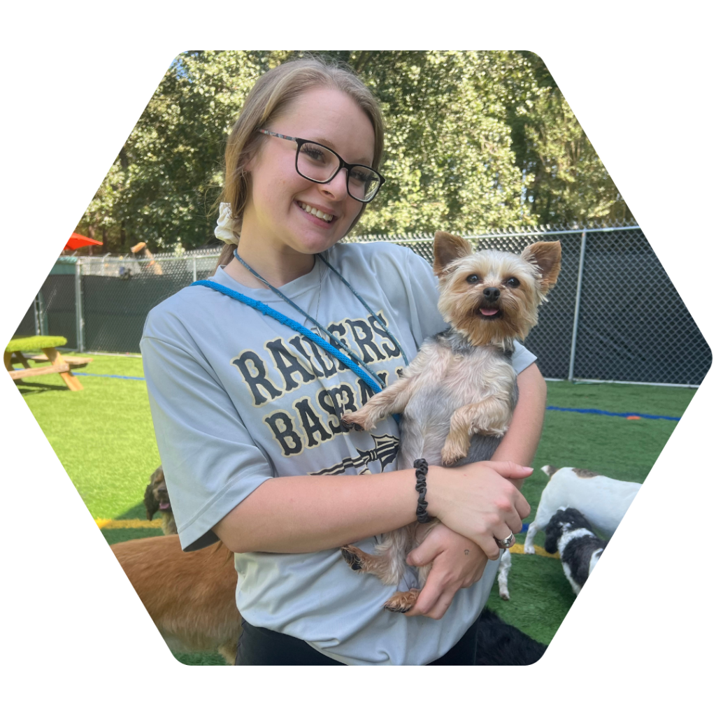 Alex Harris holding a small dog