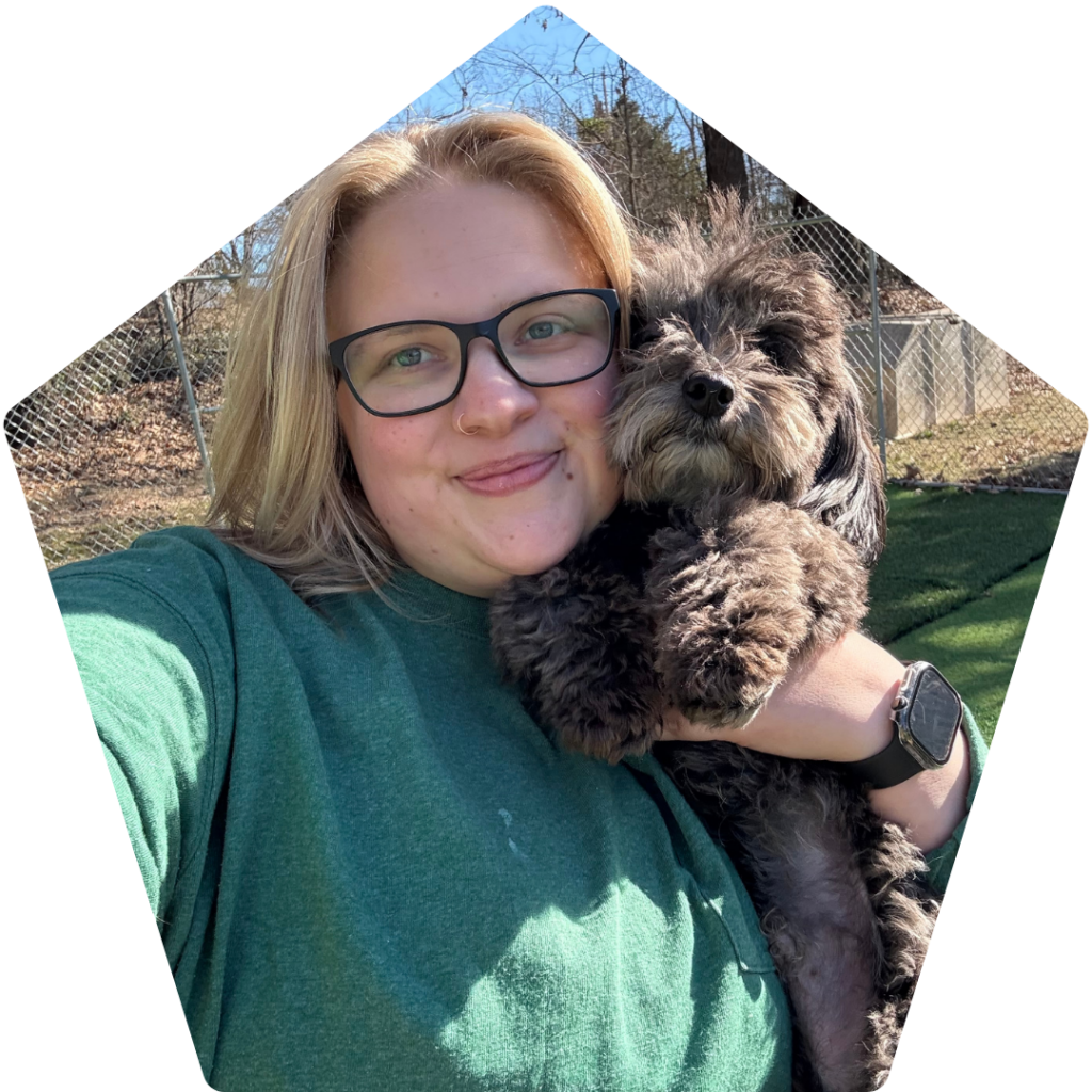 Debra Ponder holding a small dog