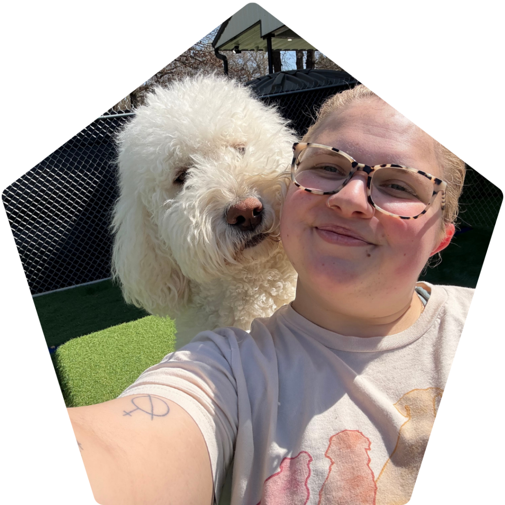 Debra Ponder taking a picture with a dog