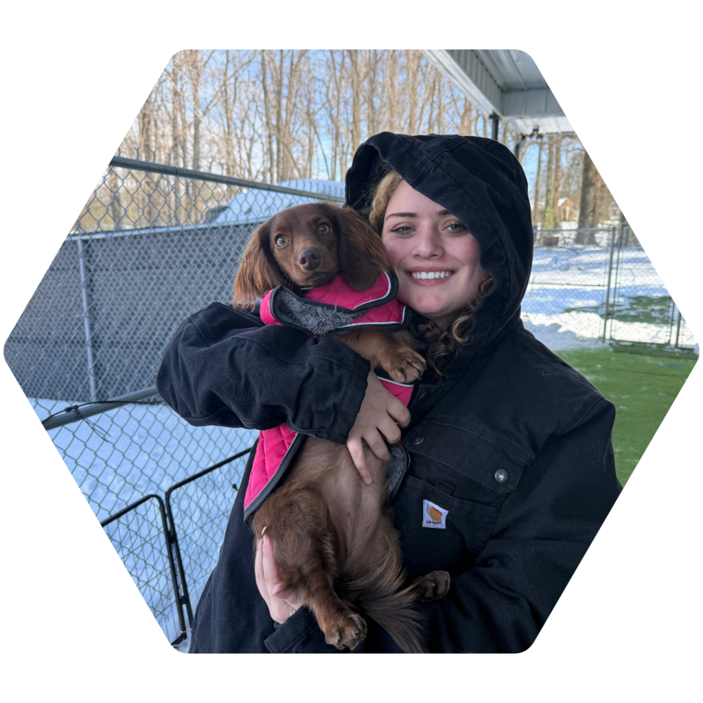 Roxy Thompson holding a small dog
