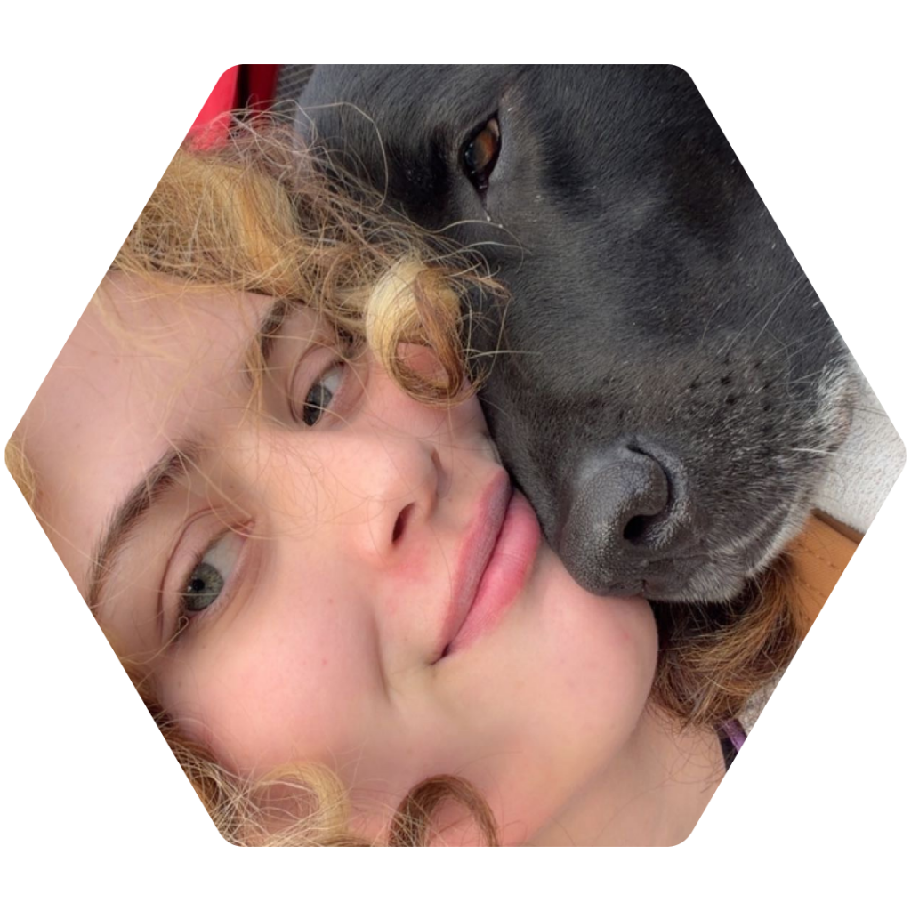 Roxy Thompson snuggling with a dog