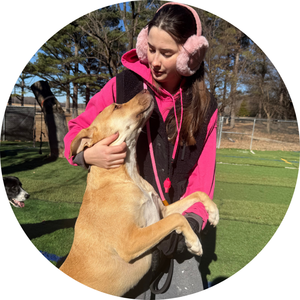 Shailey Wooldridge playing with a dog